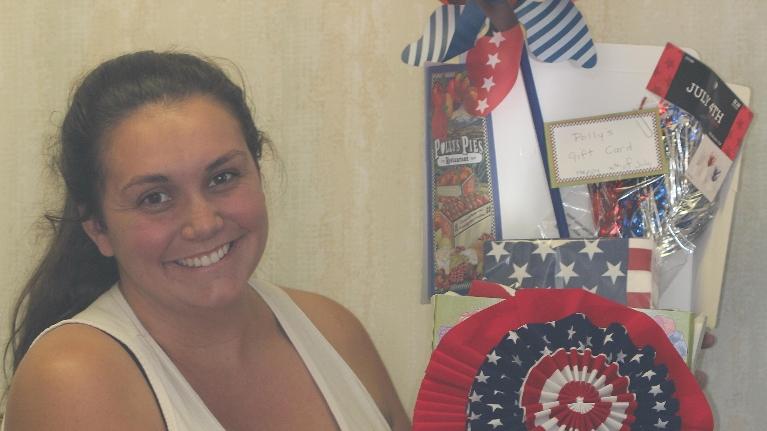 Raffle Winner Stands With Her Prize | Los Alamitos Dentist